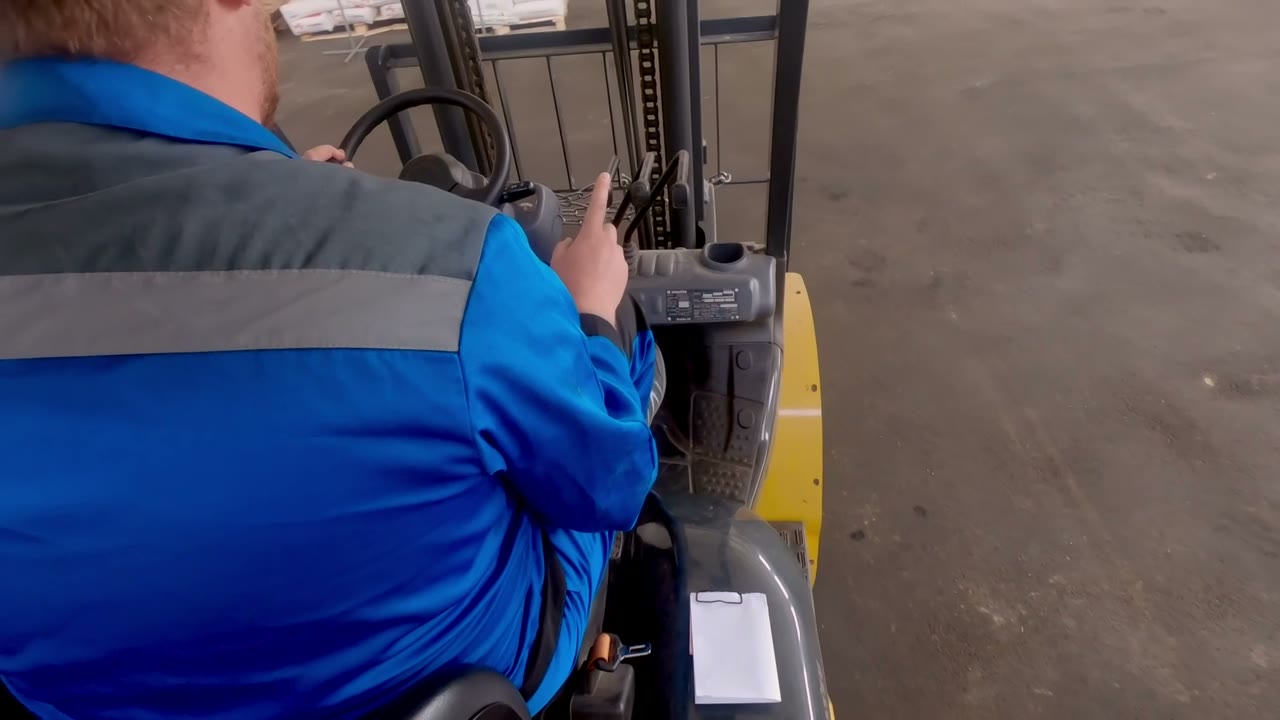 Forklift driver operating in a warehouse